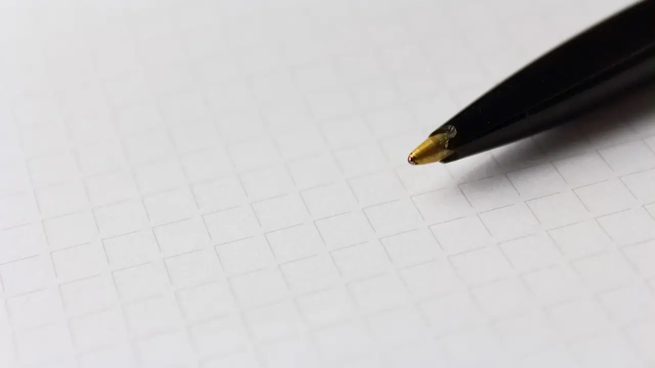 Photograph: pen, paper, checkered