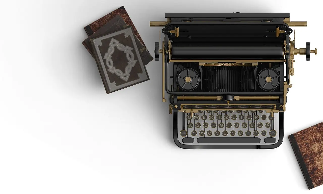 Photograph: typewriter, books, book stack